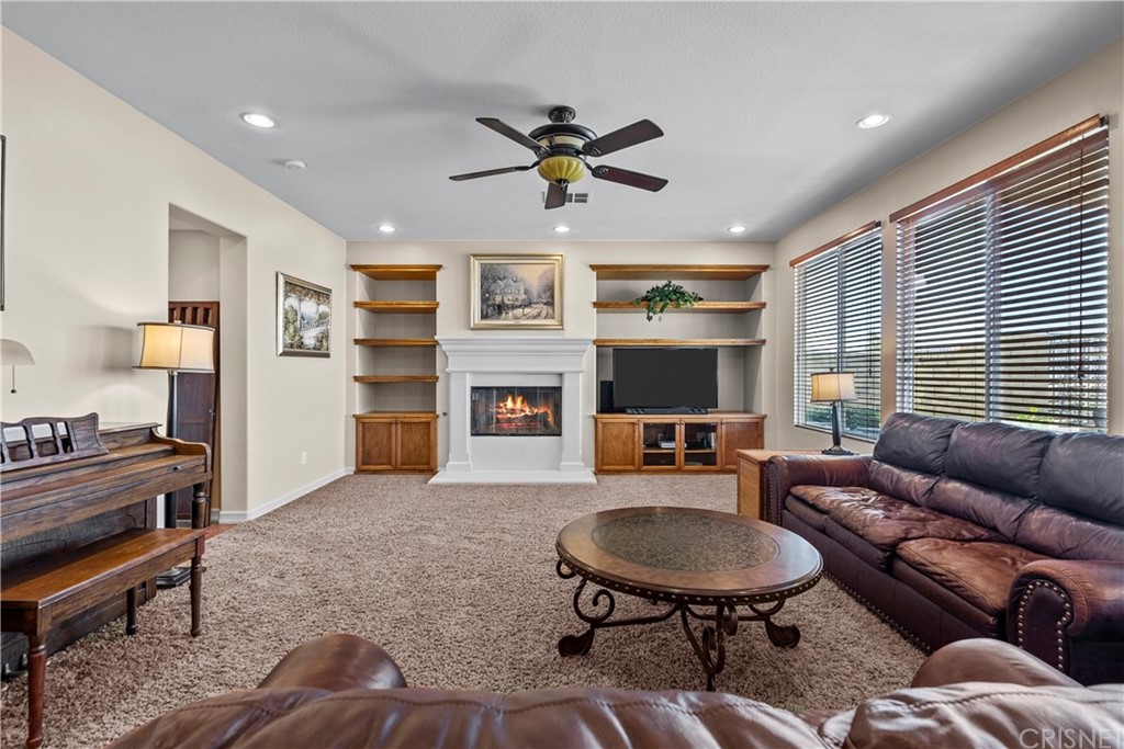 19654 Mathilde Lane Saugus, CA 91350 - Photo 12 of 38 a living room with furniture a flat screen tv and a dining table