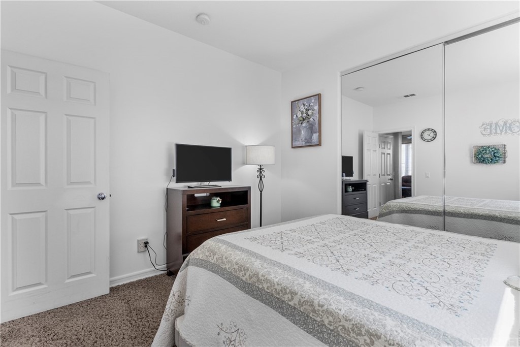 19654 Mathilde Lane Saugus, CA 91350 - Photo 16 of 38 a bedroom with a bed and a flat screen tv
