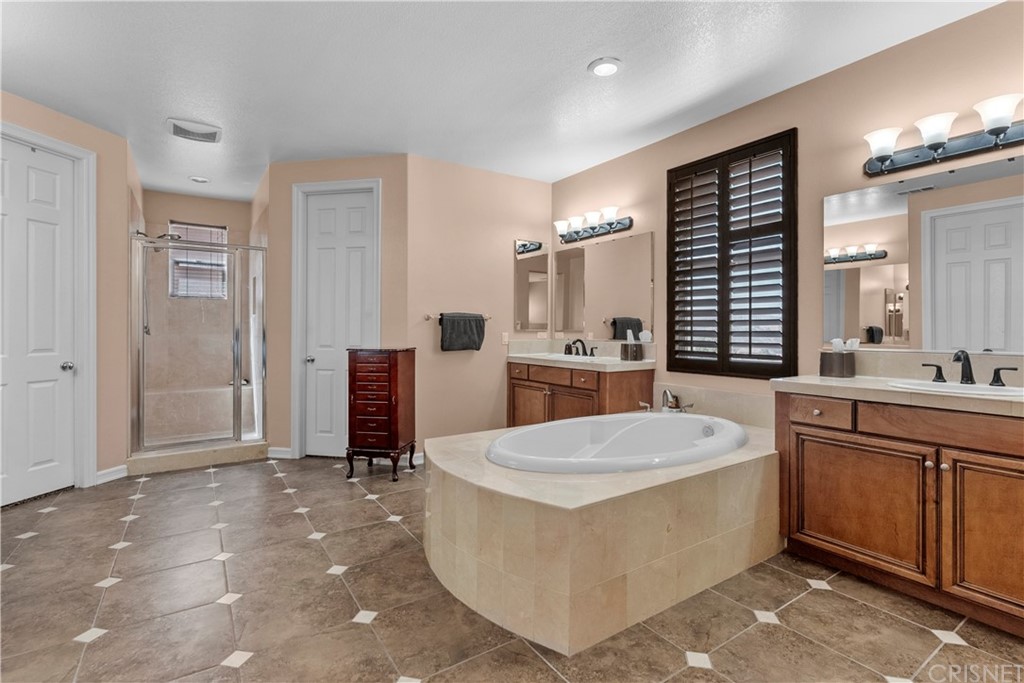 19654 Mathilde Lane Saugus, CA 91350 - Photo 27 of 38 a living room with a table and chairs