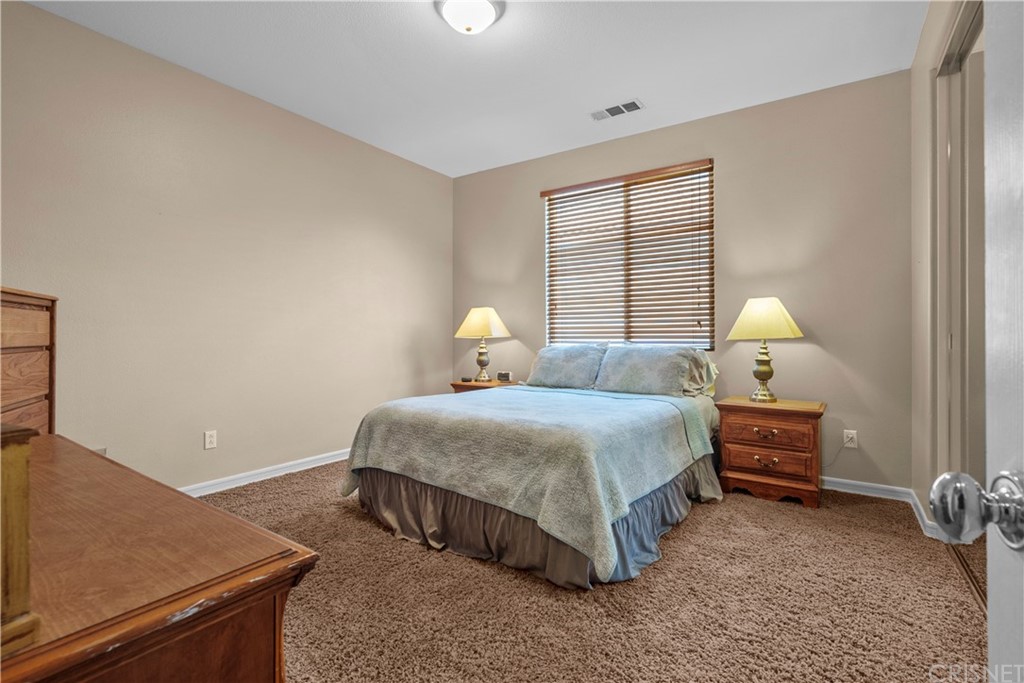 19654 Mathilde Lane Saugus, CA 91350 - Photo 31 of 38 a bedroom with a bed and window