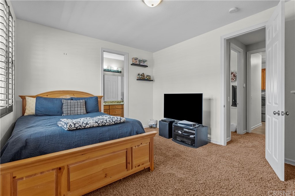 19654 Mathilde Lane Saugus, CA 91350 - Photo 32 of 38 a living room with furniture and a flat screen tv