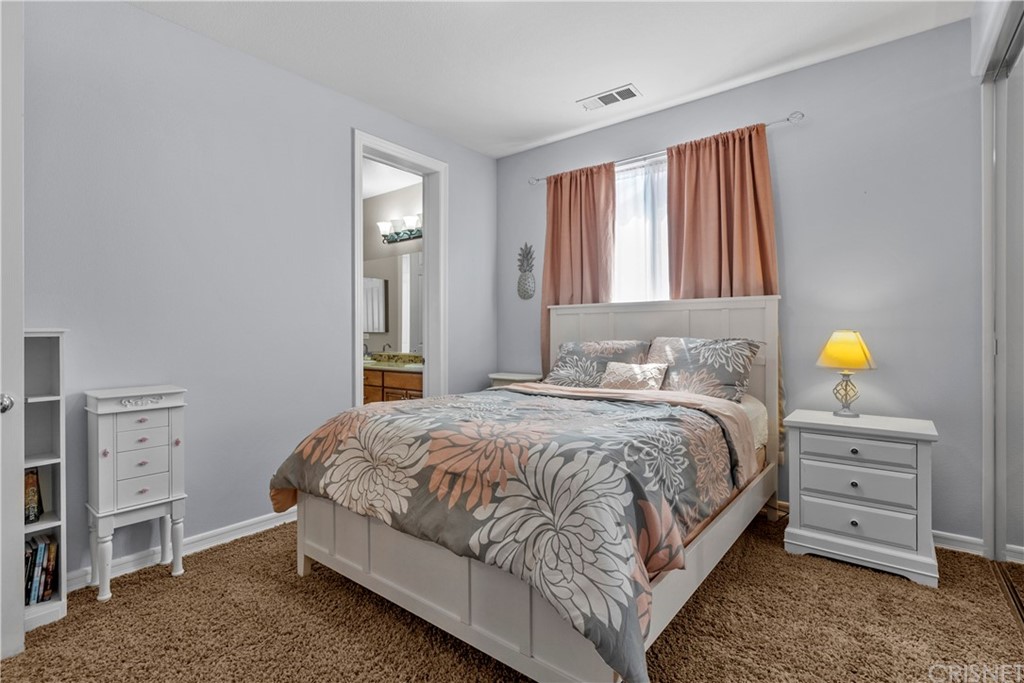 19654 Mathilde Lane Saugus, CA 91350 - Photo 33 of 38 a bedroom with a bed and a cabinets