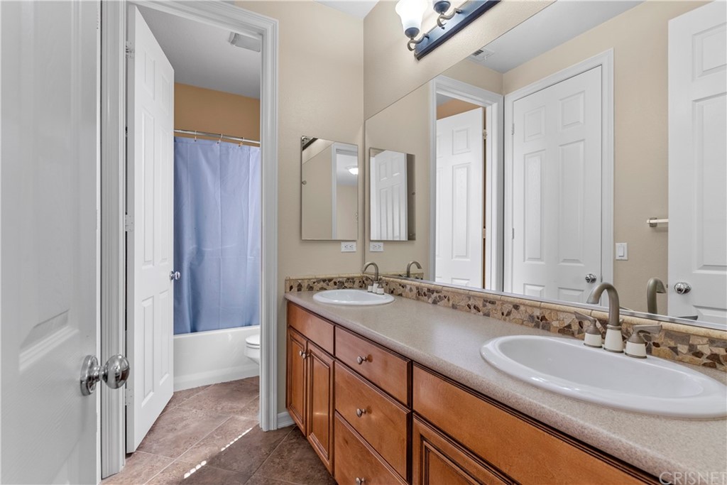 19654 Mathilde Lane Saugus, CA 91350 - Photo 35 of 38 a bathroom with a double vanity sink mirror and double
