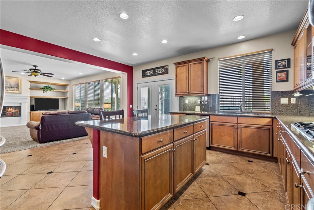 19654 Mathilde Lane Saugus, CA 91350 - Photo 10 of 38 a kitchen with stainless steel appliances granite countertop a sink and cabinets