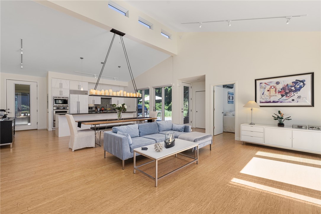 621 East Shore Road Jamestown, RI 02835 - Photo 17 of 50 Living, dining and kitchen are all open concept, and notice the clerestory windows that fill this home with such abundant light, you'll never want to leave!