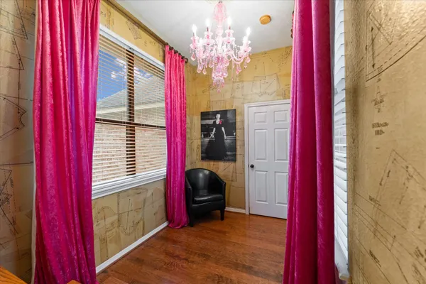 a view of a bedroom with a window and storage