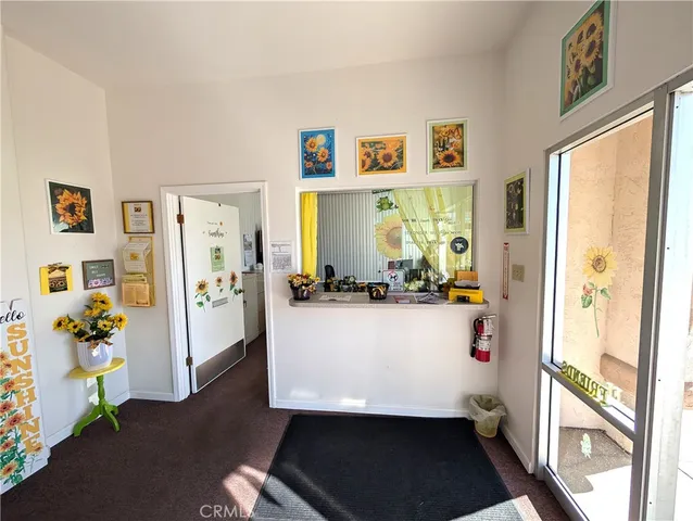a room with wooden floor and white walls