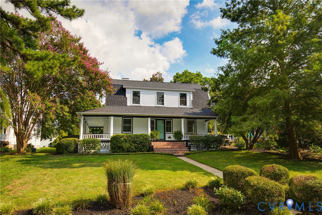 a front view of a house with swimming pool having outdoor seating