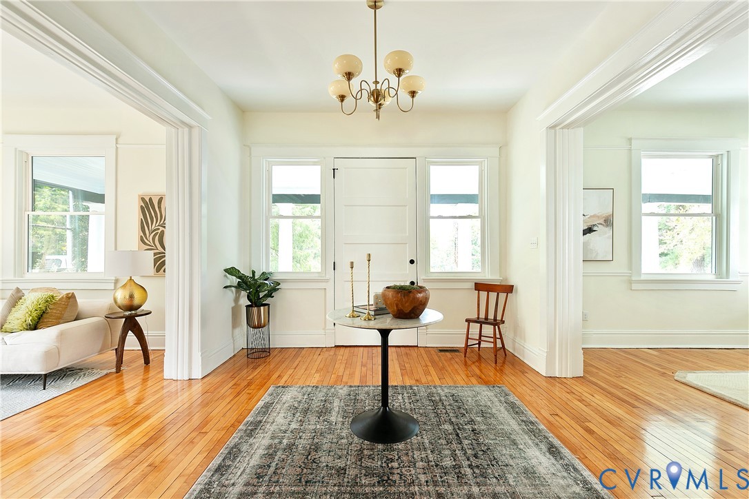 2402 Riverside Drive Richmond, VA 23225 - Photo 13 of 50 a living room with fireplace furniture and a chandelier