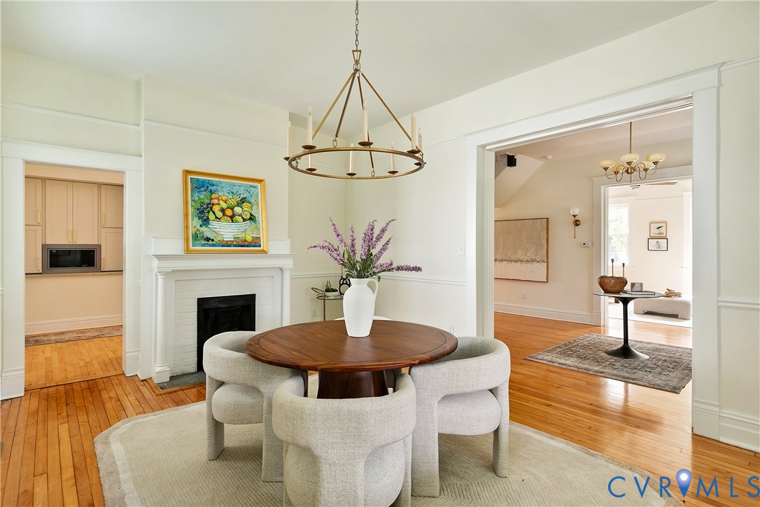 2402 Riverside Drive Richmond, VA 23225 - Photo 15 of 50 a living room with a table and chairs
