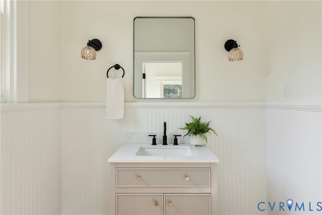 2402 Riverside Drive Richmond, VA 23225 - Photo 24 of 50 a bathroom with a sink and a mirror
