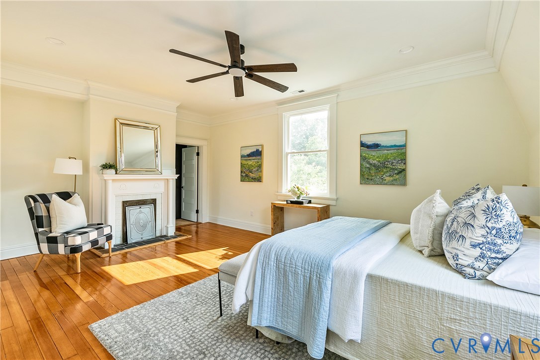 2402 Riverside Drive Richmond, VA 23225 - Photo 26 of 50 a bedroom with a bed and wooden floor