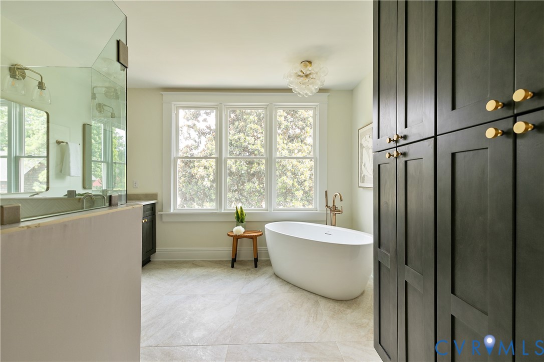 2402 Riverside Drive Richmond, VA 23225 - Photo 28 of 50 a spacious bathroom with a tub and shower