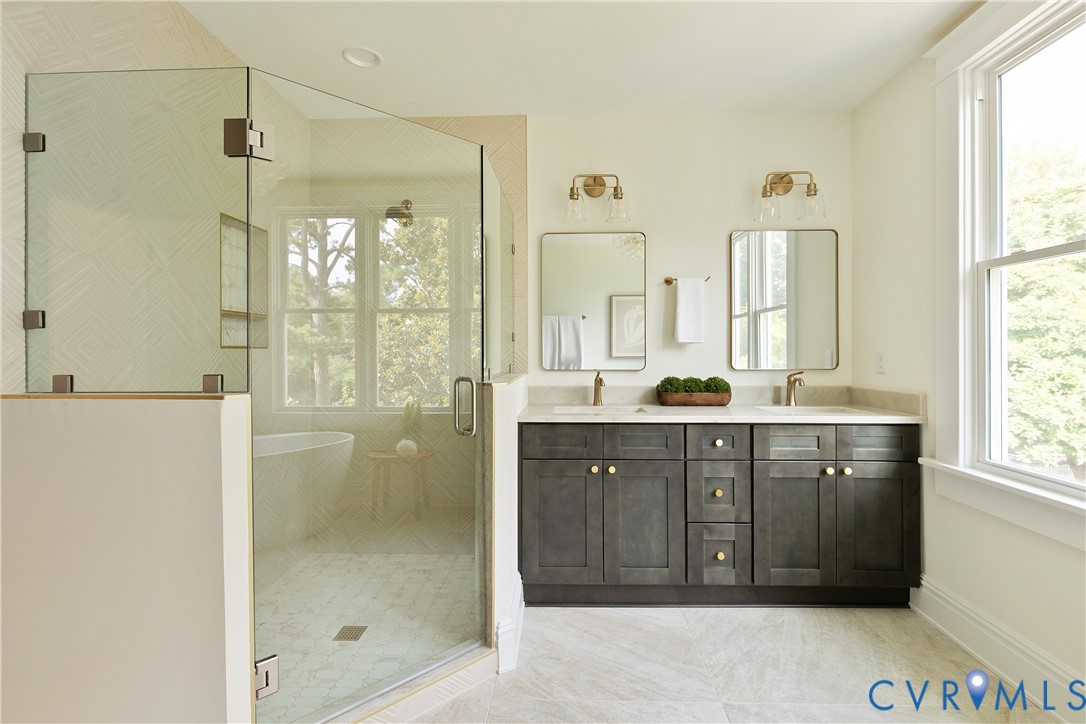 2402 Riverside Drive Richmond, VA 23225 - Photo 29 of 50 a spacious bathroom with a shower sink and mirror