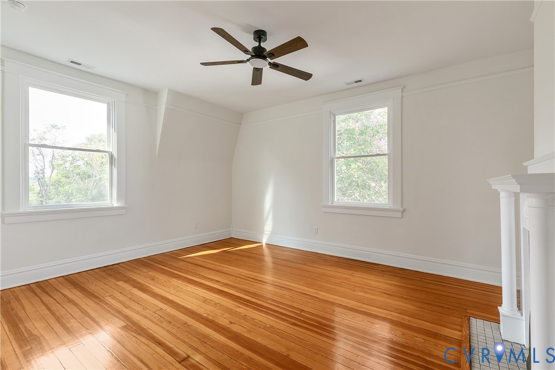 2402 Riverside Drive Richmond, VA 23225 - Photo 31 of 50 a view of an empty room with wooden floor and a window