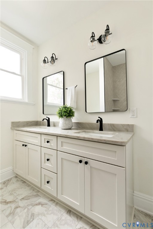2402 Riverside Drive Richmond, VA 23225 - Photo 35 of 50 a bathroom with a double vanity sink mirror and
