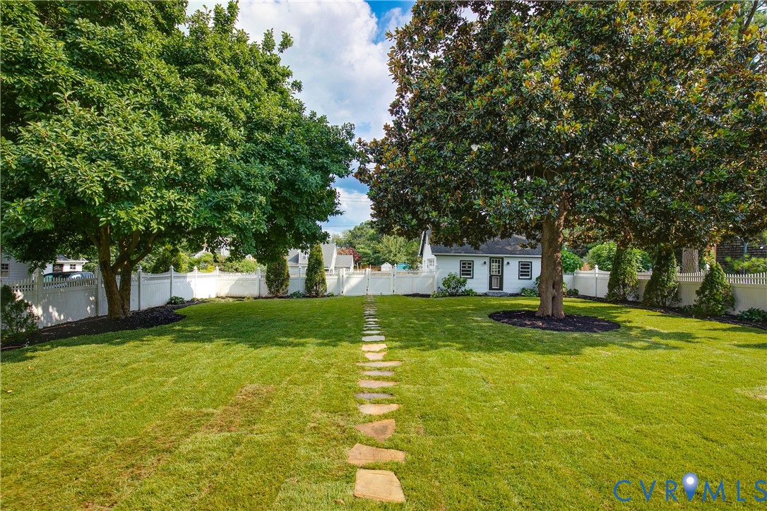 2402 Riverside Drive Richmond, VA 23225 - Photo 40 of 50 a view of a fountain in front of a house with large trees