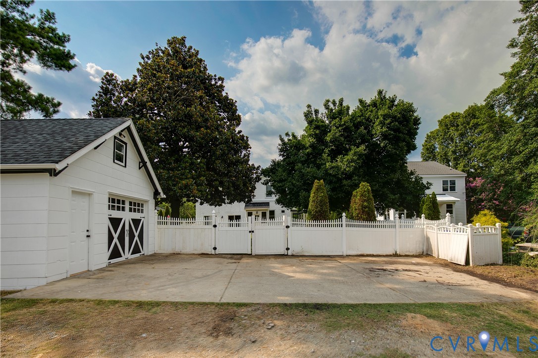 2402 Riverside Drive Richmond, VA 23225 - Photo 45 of 50 a view of a white house with a road