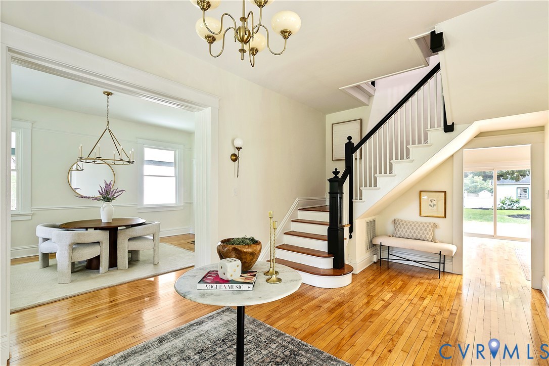 2402 Riverside Drive Richmond, VA 23225 - Photo 9 of 50 a view of dining room and hall with wooden floor