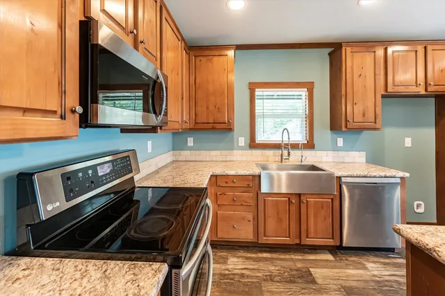 a kitchen with a stove and a sink