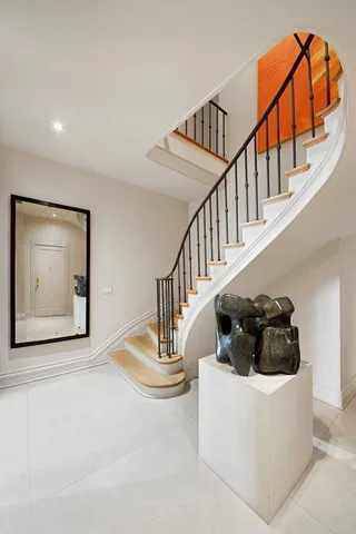 a kitchen with a stove a sink and cabinets