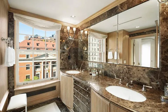 a bedroom with a bed and large window