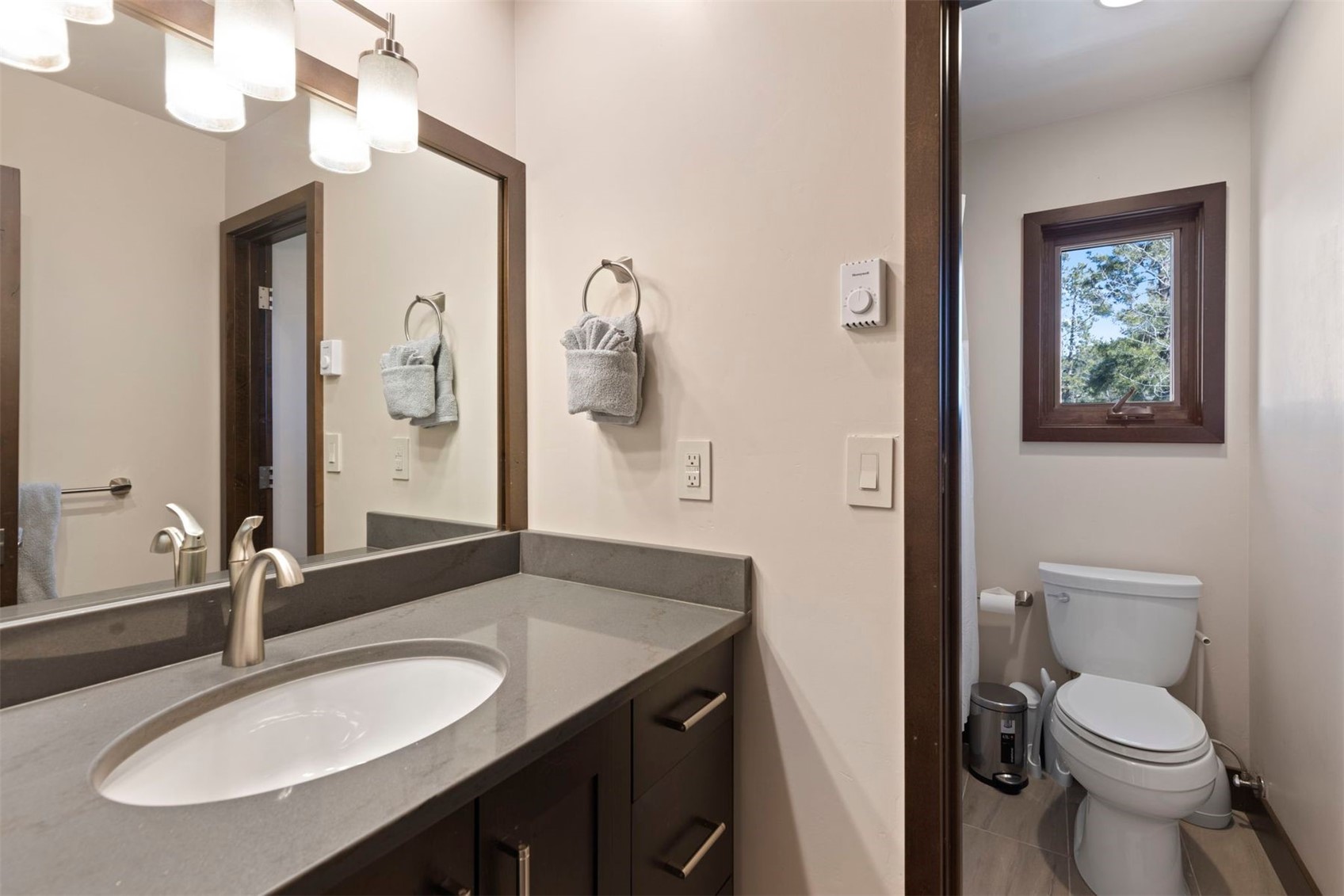 103 Bearing Tree Road Breckenridge, CO 80424 - Photo 17 of 30 a bathroom with a granite countertop sink and a mirror