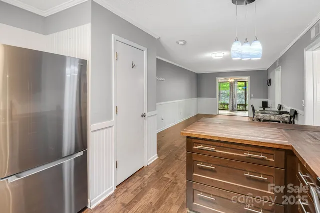 a view of a hallway view with wooden floor and staircase