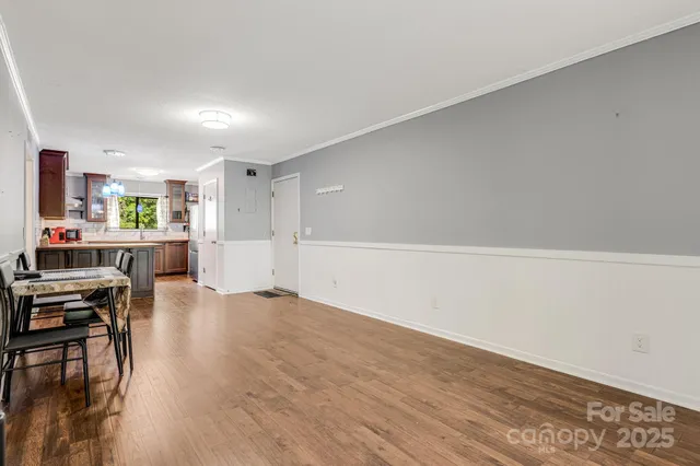 a view of a kitchen with dining table and chairs