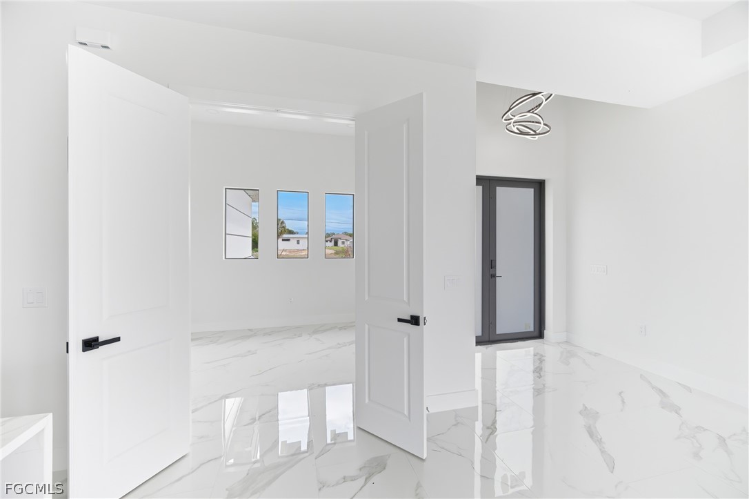 1013 Anson Avenue Lehigh Acres, FL 33971 - Photo 12 of 33 a bathroom with a shower