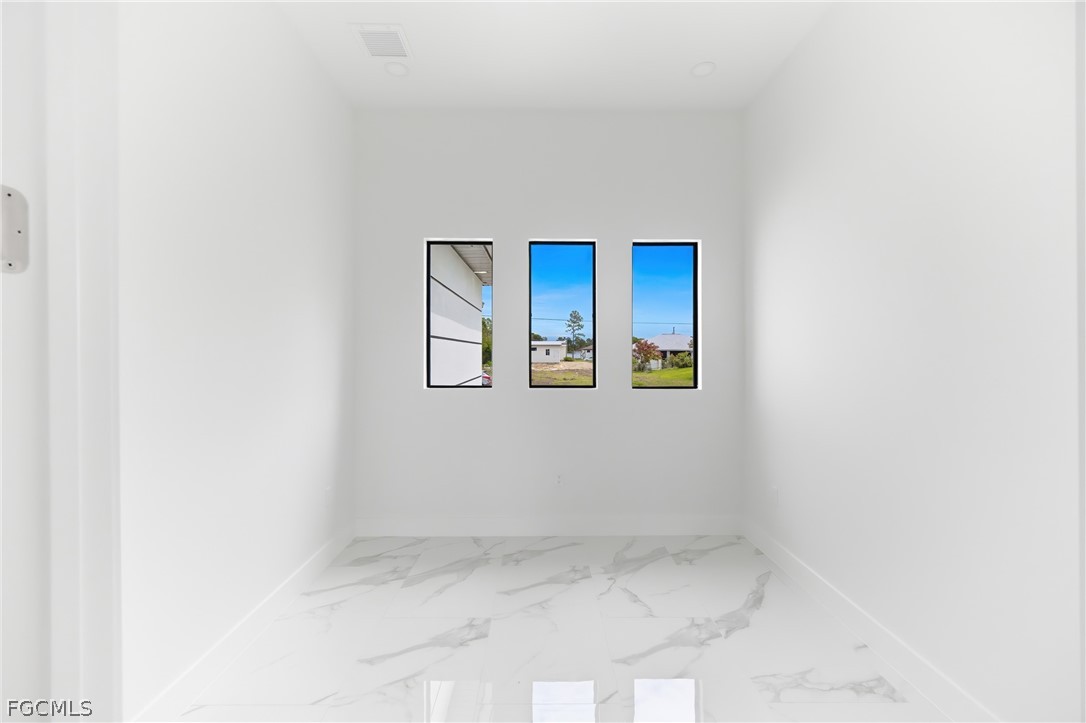 1013 Anson Avenue Lehigh Acres, FL 33971 - Photo 13 of 33 a view of an empty room