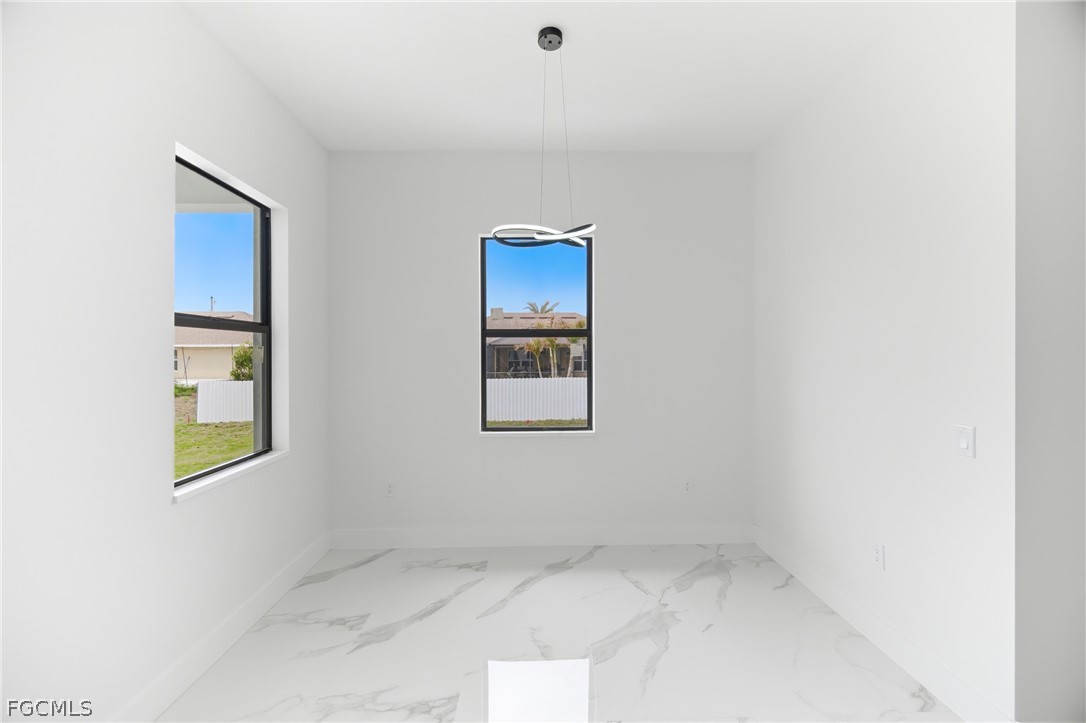 1013 Anson Avenue Lehigh Acres, FL 33971 - Photo 14 of 33 a view of an empty room with a window
