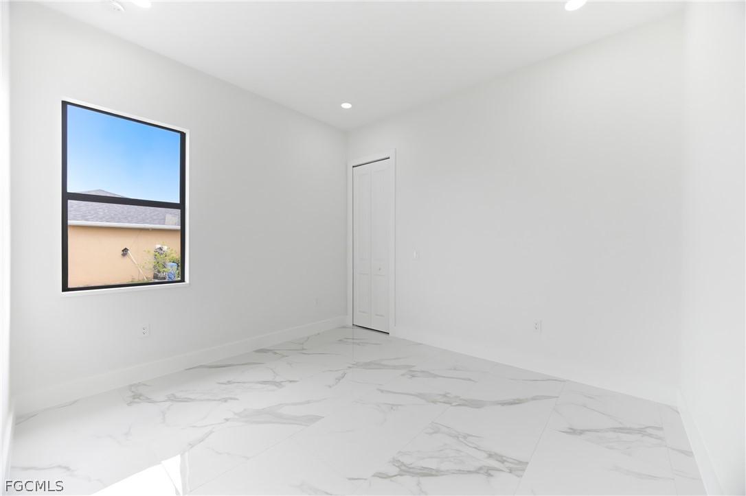 1013 Anson Avenue Lehigh Acres, FL 33971 - Photo 16 of 33 a view of an empty room