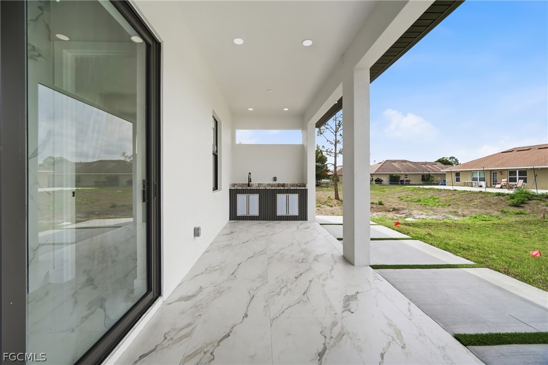 1013 Anson Avenue Lehigh Acres, FL 33971 - Photo 23 of 33 a view of an entryway of a house