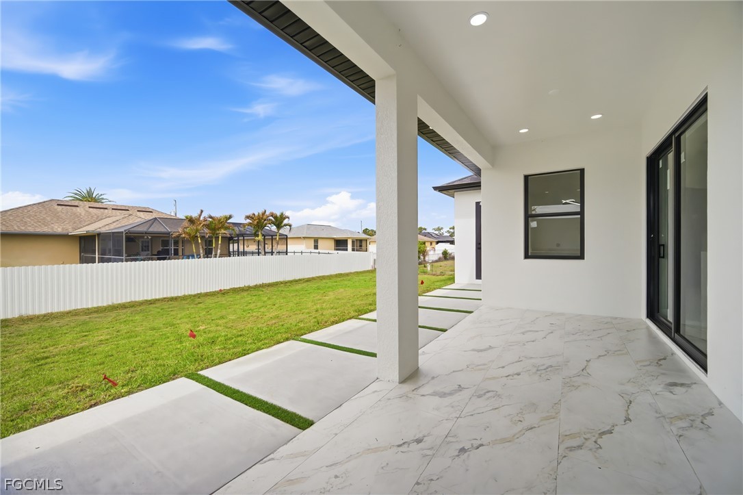 1013 Anson Avenue Lehigh Acres, FL 33971 - Photo 25 of 33 a view of a back yard of the house