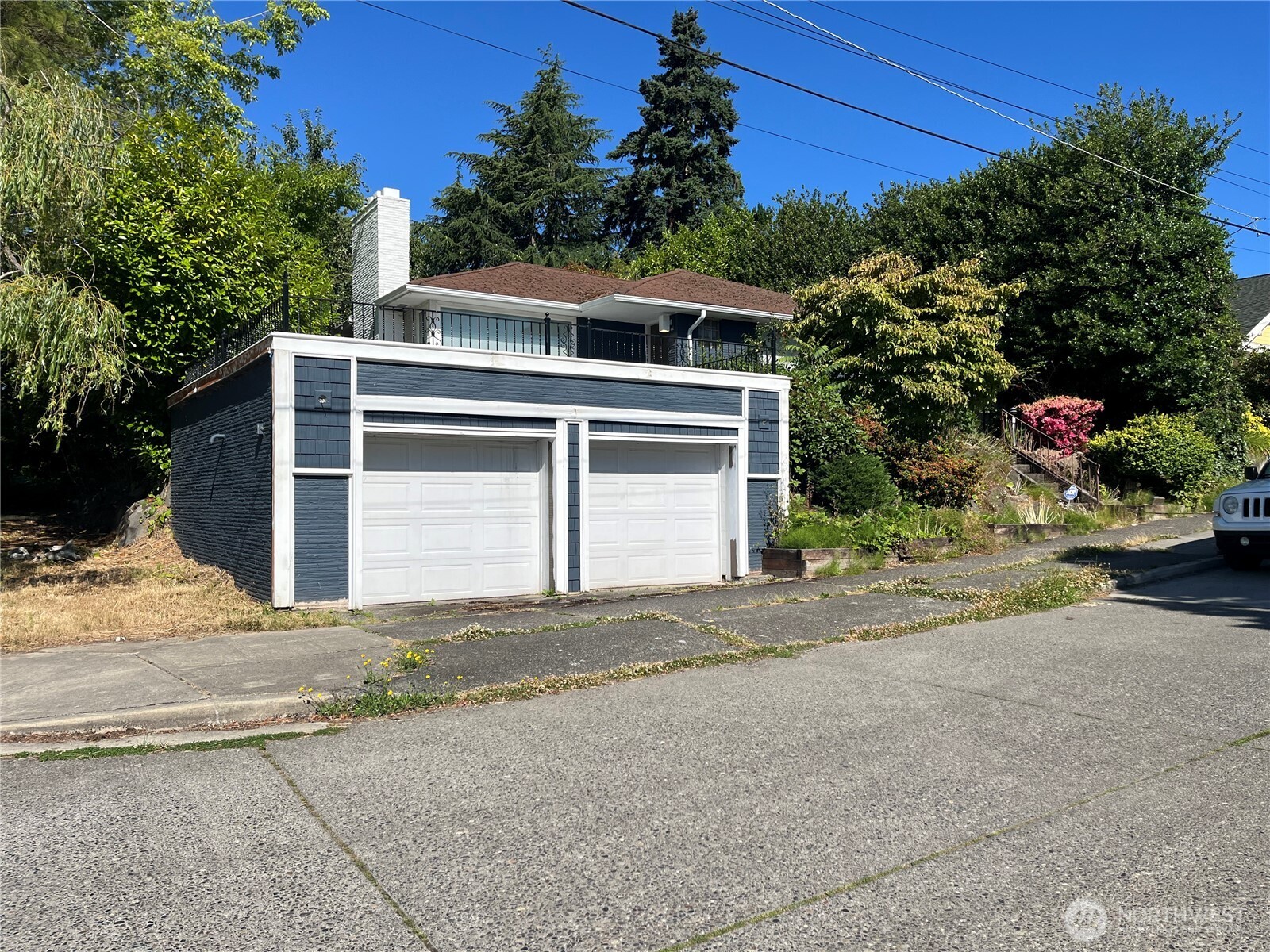 6925 52nd Avenue South Seattle, WA 98118 - Photo 1 of 9 a front view of a house with a yard and garage