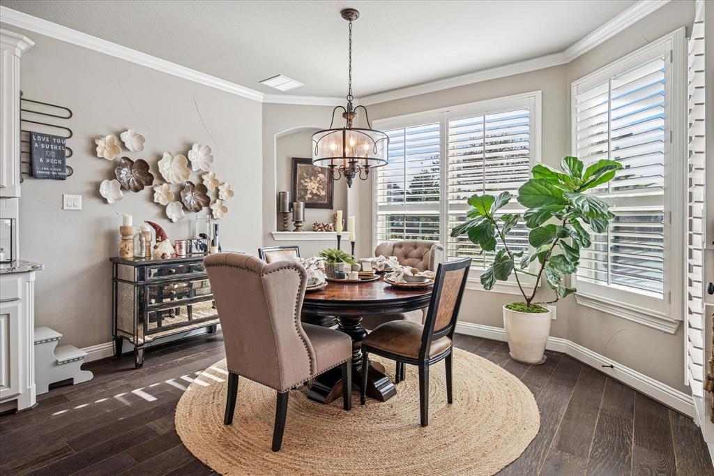 2880 Redfern Drive Trophy Club, TX 76262 - Photo 14 of 40 a dining room with furniture potted plants and wooden floor