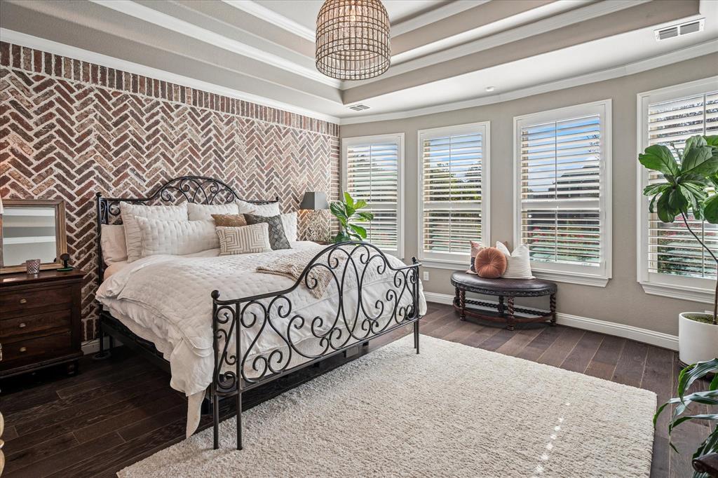 2880 Redfern Drive Trophy Club, TX 76262 - Photo 17 of 40 a bedroom with a bed and a chandelier