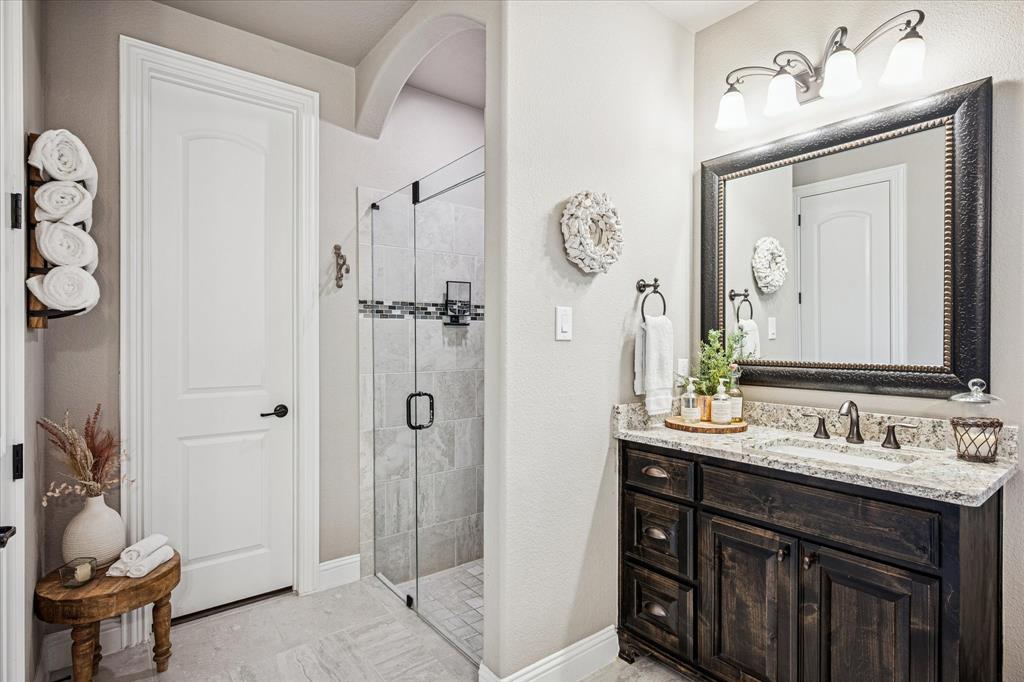 2880 Redfern Drive Trophy Club, TX 76262 - Photo 20 of 40 a bathroom with a sink vanity and a mirror