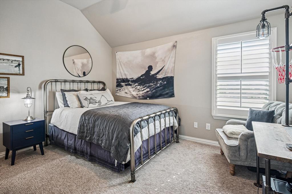 2880 Redfern Drive Trophy Club, TX 76262 - Photo 24 of 40 a bedroom with a bed a mirror and a table