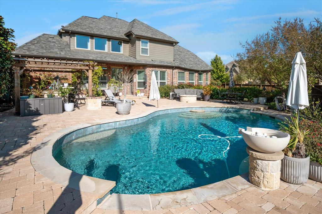 2880 Redfern Drive Trophy Club, TX 76262 - Photo 29 of 40 a view of a house with backyard sitting area and garden