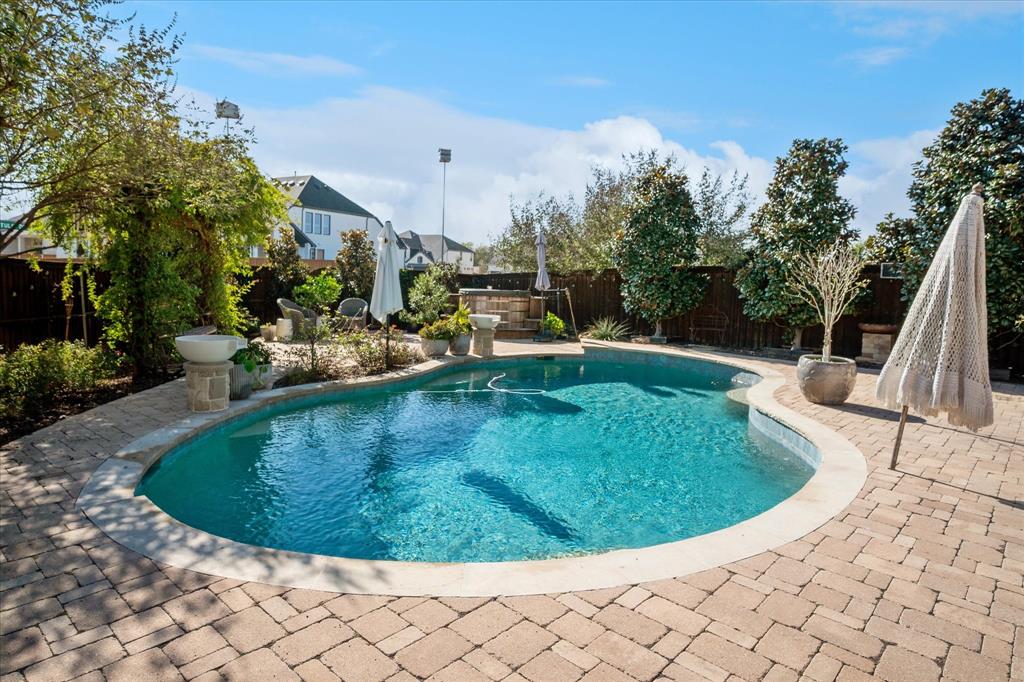 2880 Redfern Drive Trophy Club, TX 76262 - Photo 33 of 40 a view of a swimming pool with a sitting space