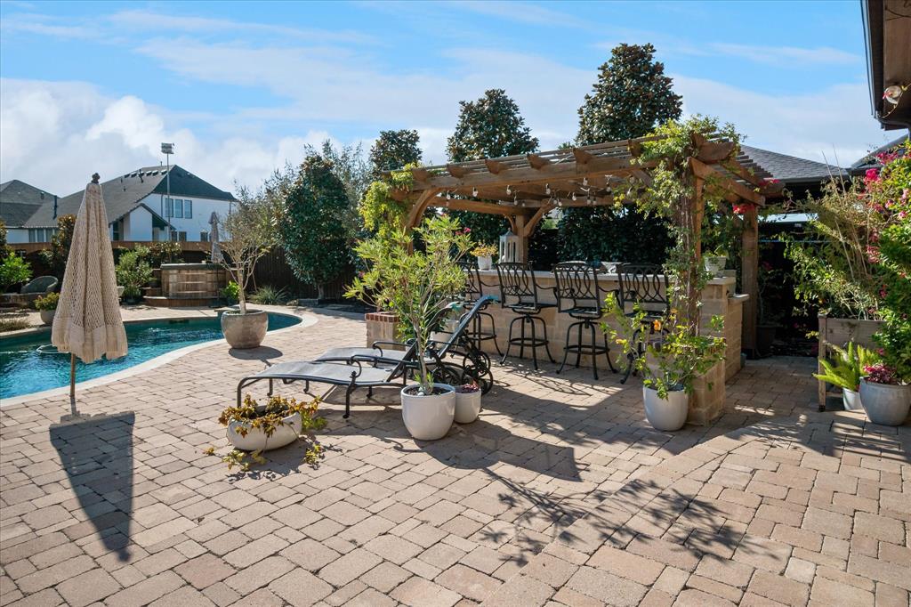 2880 Redfern Drive Trophy Club, TX 76262 - Photo 35 of 40 a view of a patio with table and chairs potted plants