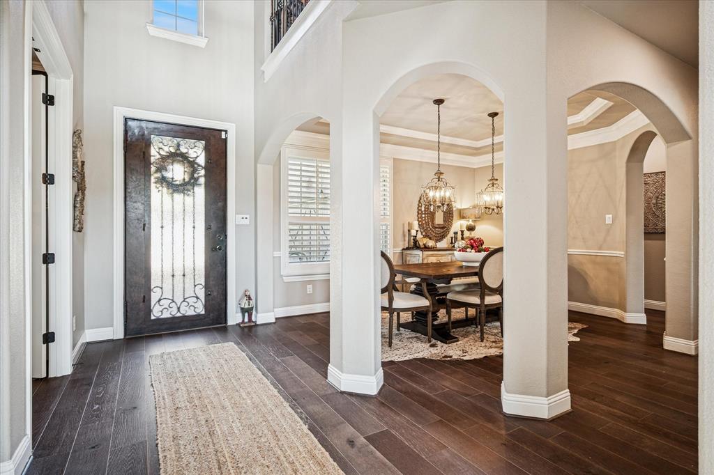 2880 Redfern Drive Trophy Club, TX 76262 - Photo 4 of 40 a view of a hallway with wooden floor and dining room