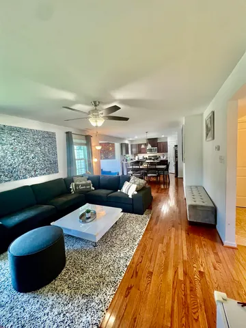 a view of a dining room with furniture and wooden floor