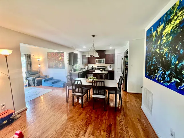 a bed room with wooden floor and furniture