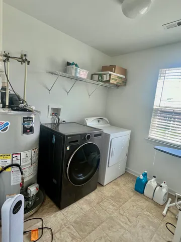 a bedroom with furniture and a wooden floor