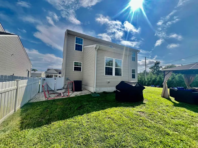 a house view with a seating space and garden