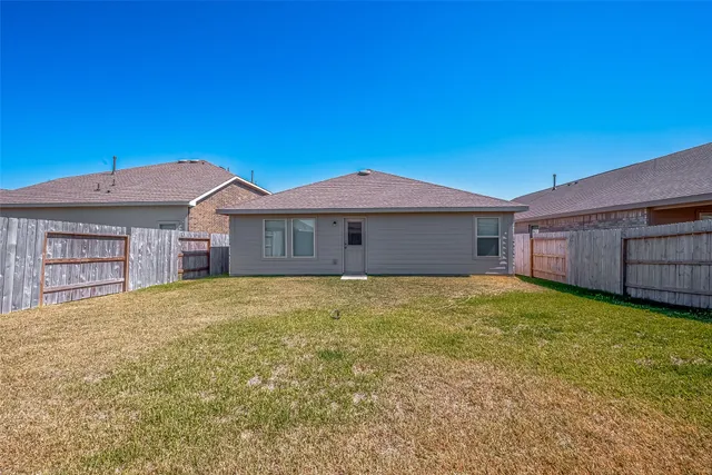 a view of a house with a yard and garage