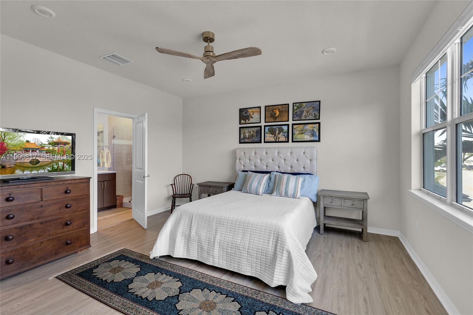 4810 Eucalyptus Drive, Unit 3 Hollywood, FL 33021 - Photo 14 of 32 a bedroom with a bed and a dresser